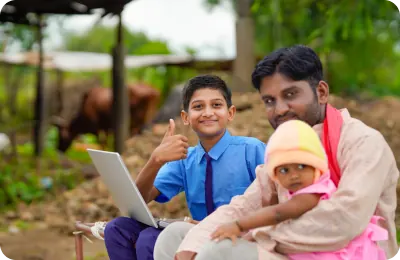 A student learning with digital tools alongside his family