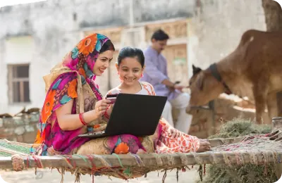 Two women learning together on a laptop